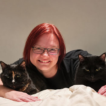 Happy pet cat sitter with her two fur babies.