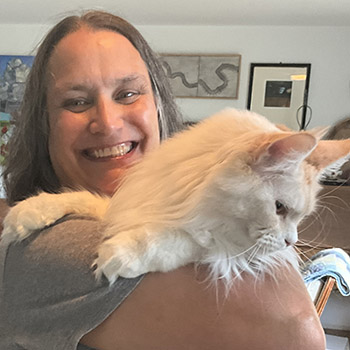 Happy cat sitter eager to help you take care of your feline friend while you're away and have piece fo mind.