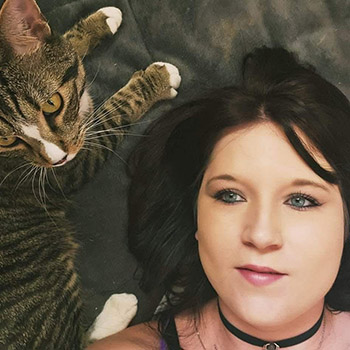 Kitty sitter in an artistic photo with her cat friend.
